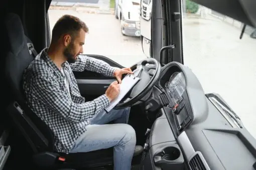 Truck driver sitting in cab 2026 03 24 04 47 41 utc (1)