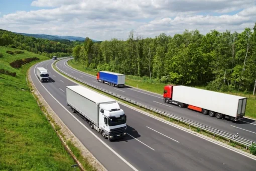 Depositphotos 117830708 stock photo trucks traveling on an asphalt