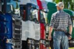 Man inspecting semi trucks at dealership lot 2026 03 24 00 32 09 utc (1)