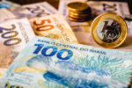 In this photo illustration being displayed one hundred and two hundred reais bills and a one